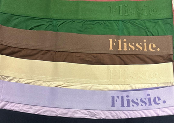 Folded bamboo viscose underwear in several colours on a plain background