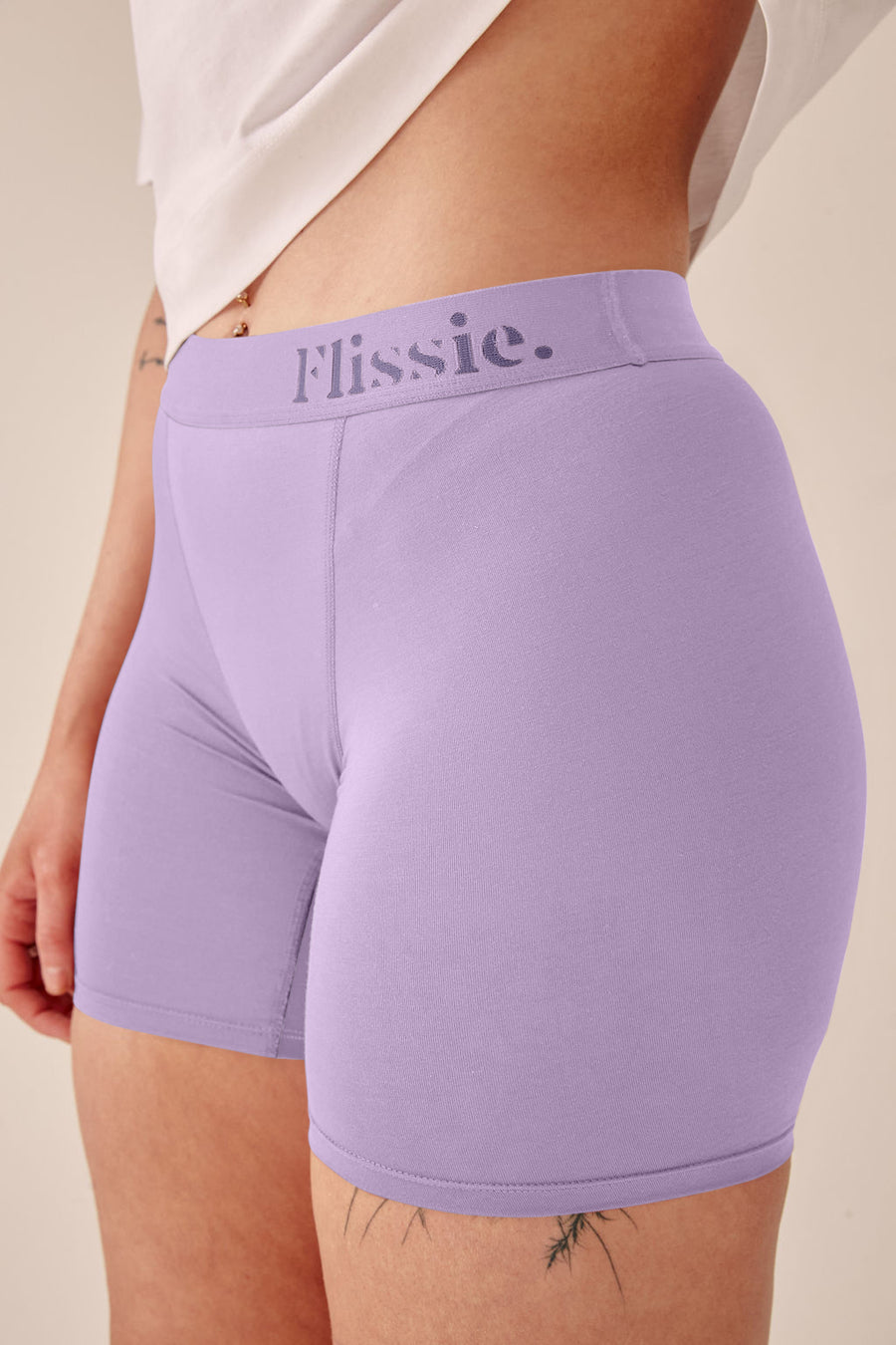Close-up of the wide Flissie waistband on lavender purple bamboo boxer shorts